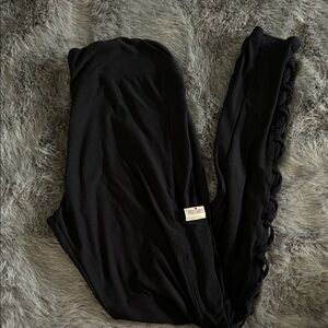 Black southern fried chics leggings with mesh cross detail on calves